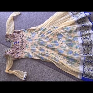 Pakistani/Indian dress with heavy embroidery.